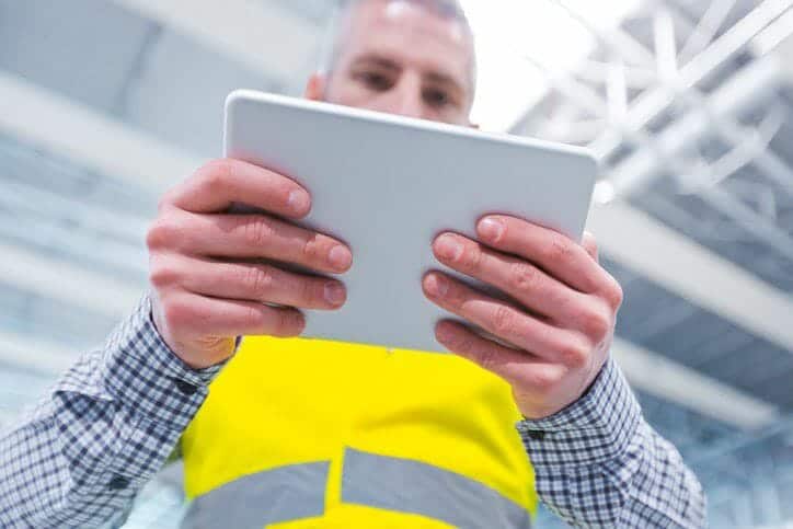 Worker holds iPad